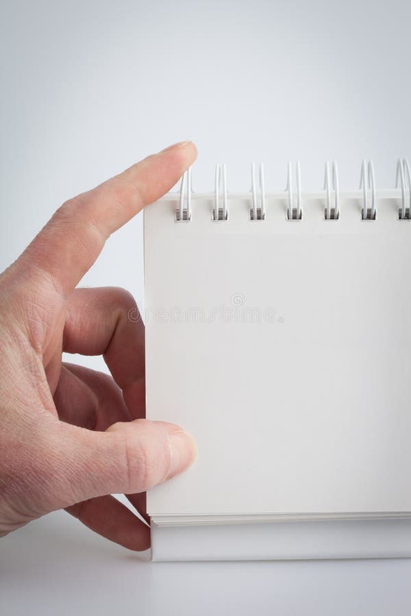 Hand Holding a Blank Note Pad Stock Photo Image of finger, background