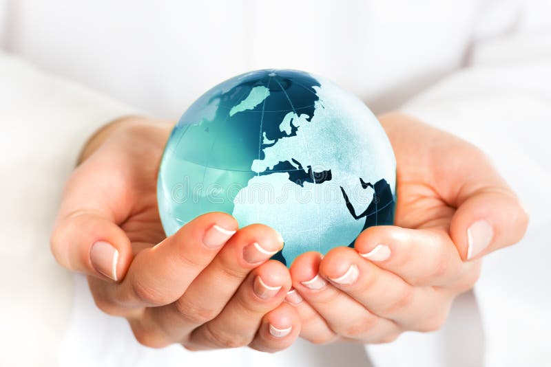 Hand holding blue earth globe