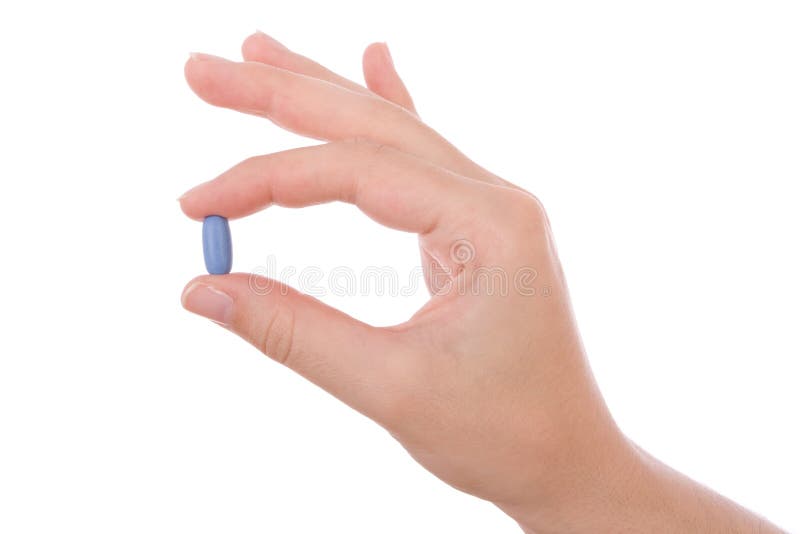 Hand holding a blue pill