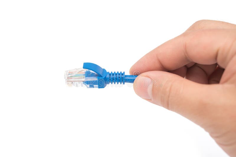 Hand holding a blue RJ45 computer network connecting cable royalty free stock images