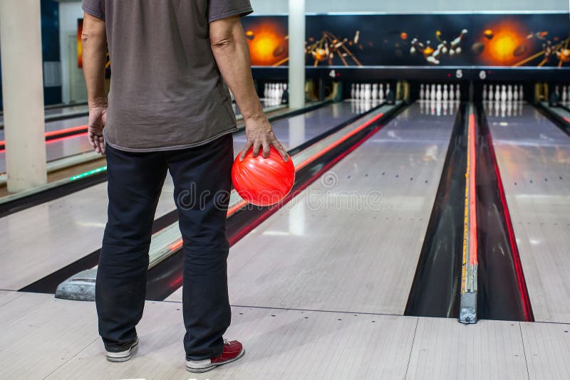 The Hand Holding the Bowling Ball in the Background of the Playing