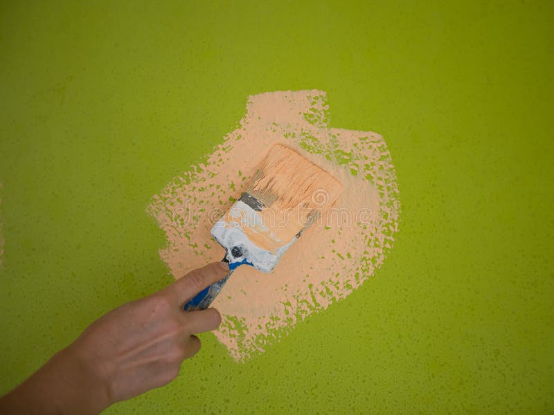 Hand Holding Brush Painting Timber Wall. Stock Photo Image of