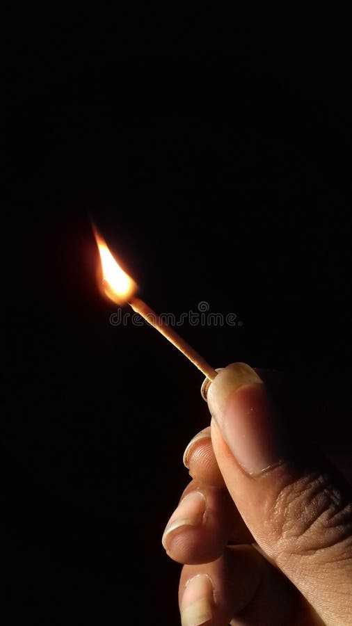 Hand Holding a Burning Matchstick Isolated Image Stock Photo Image