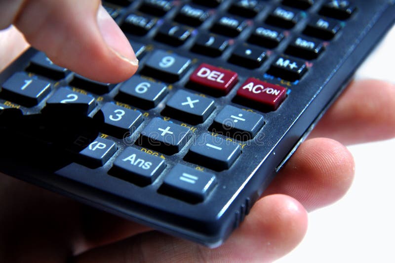 Hand holding a calculator stock image. Image of subtract 20354553