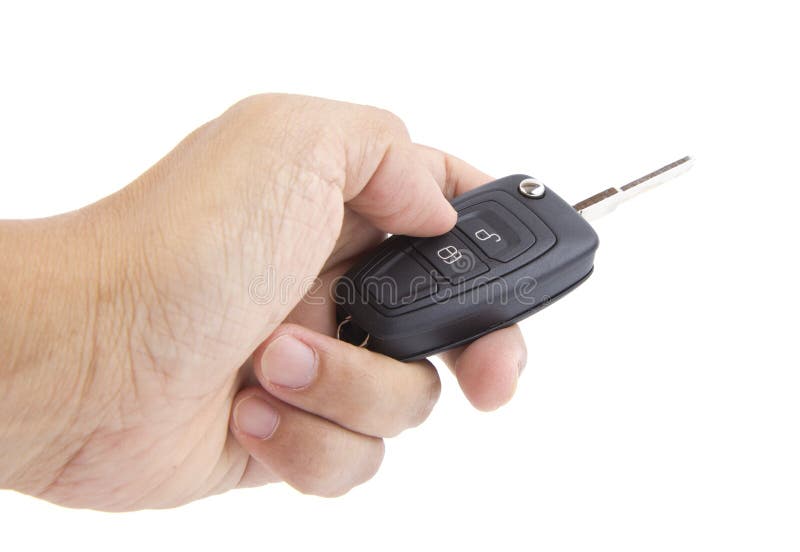 Hand holding a car key. stock photo