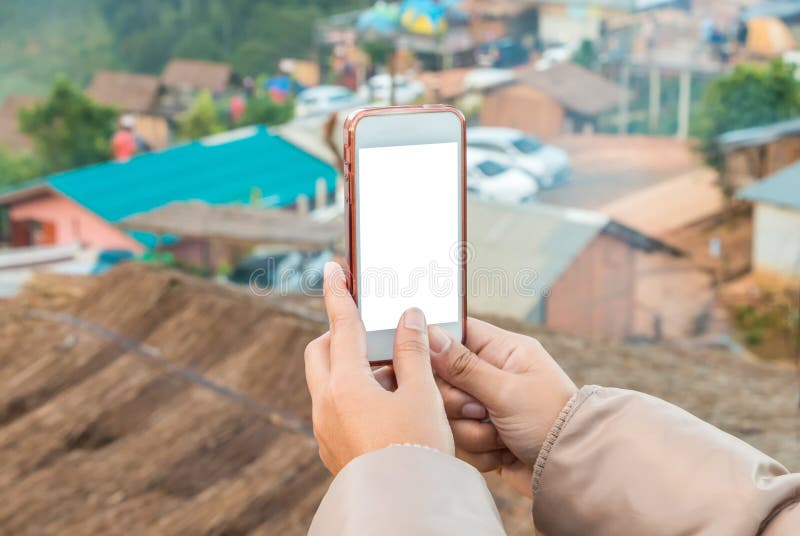 Hand holding cell phone to take a photo view of city stock photos Hand holding cell phone to take a photo view of city stock photos
