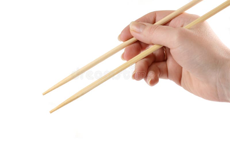 Hand holding the chopsticks