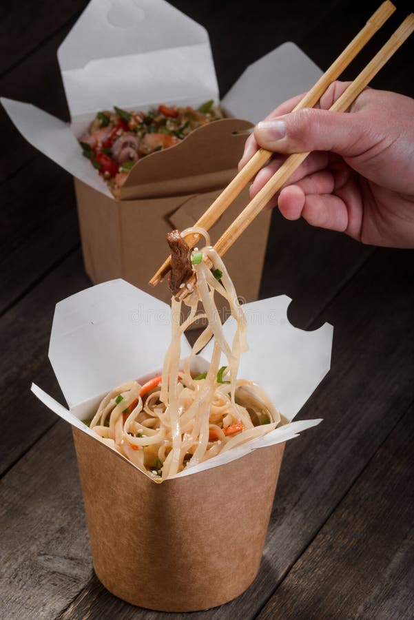 Hand Holding Chopsticks With Noodles Stock Image - Image of oriental, noodle: 129529281