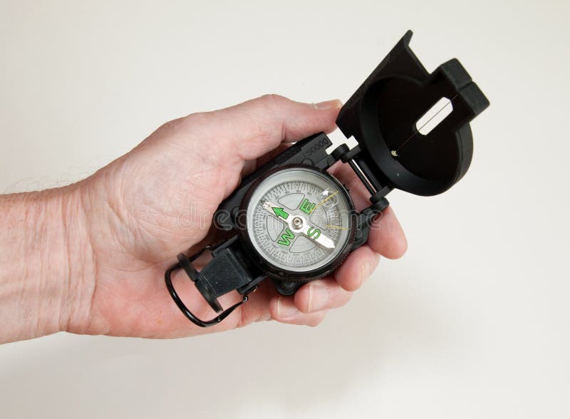 Hand Holding Compass stock photo. Image of course, compass 12055864
