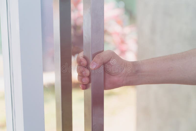 hand holding door knob, opening door, selective focus royalty free stock photo hand holding door knob, opening door, selective focus royalty free stock photo