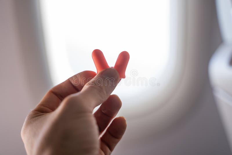Hand Holding Earplugs in Airplane Stock Image Image of inside