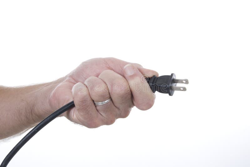 Hand holding electric plug