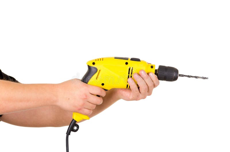Hand holding electric yellow drill tool stock image