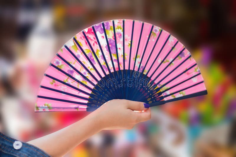 Hand holding a fan stock image. Image of style, closeup 18316761