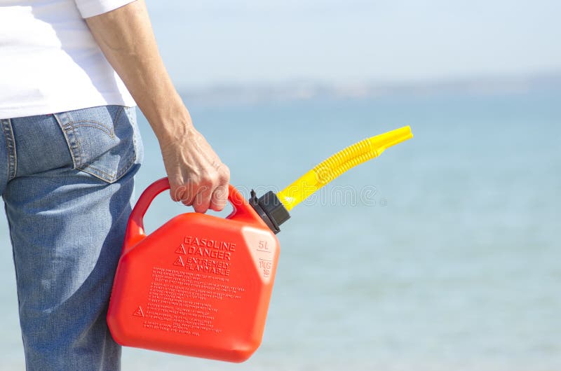 Hand holding fuel can stock image. Image of blurred, concept 26321147