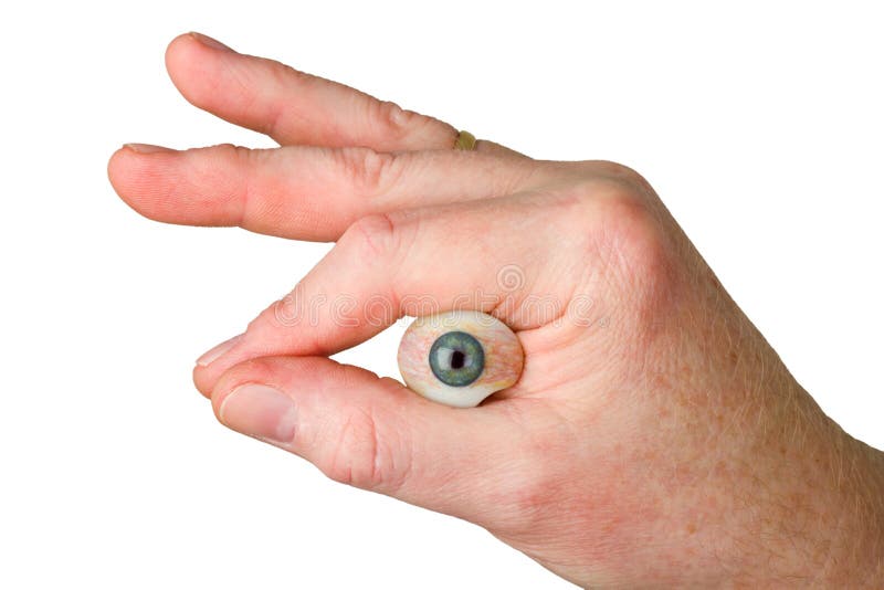 Hand holding glass eye