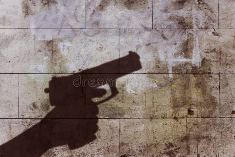 Hand holding gun silhouette