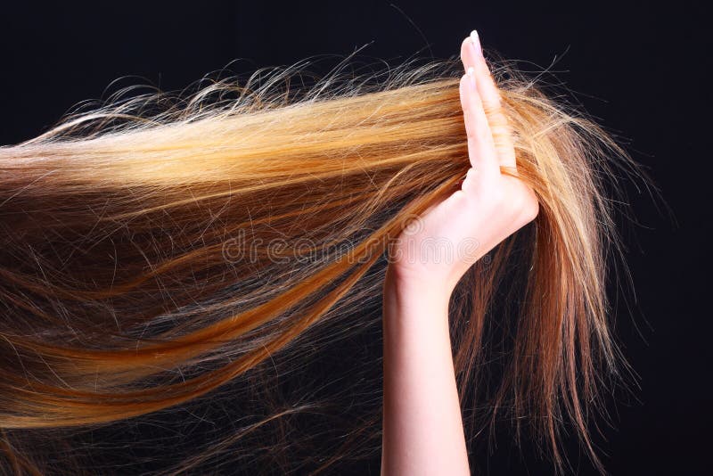 Hand holding hair. Hairstyle