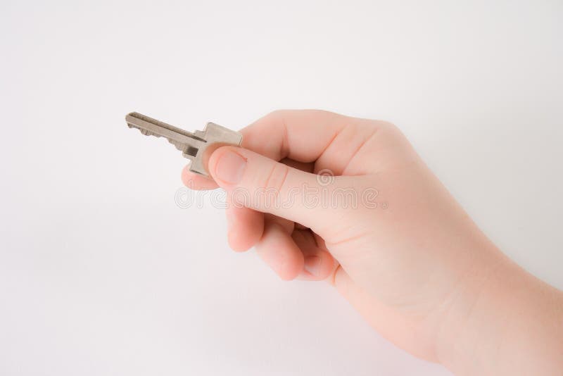 Hand holding a house key