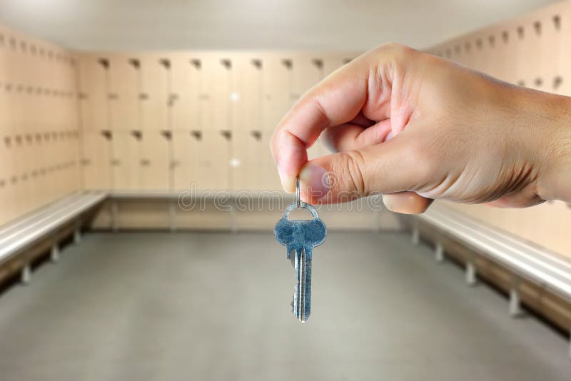 Hand Holding a Key in a Locker Room Stock Photo Image of holding