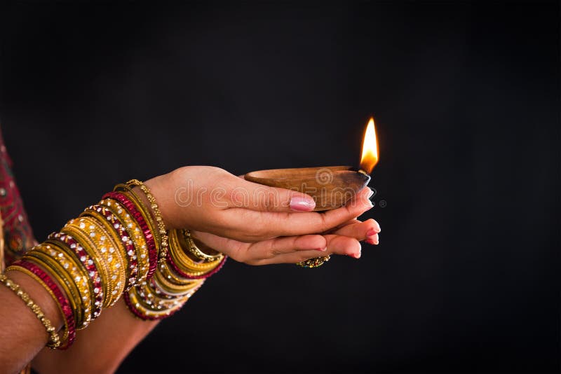 Hand holding lantern during diwali festival of lights