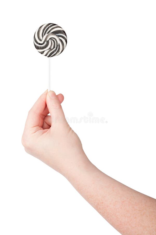 Hand holding lollipop stock image. Image of large, bright - 27204149