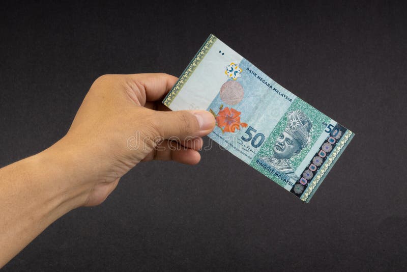 Hand Holding Malaysia Ringgit MYR Currency Bank Notes. Stock Image ...