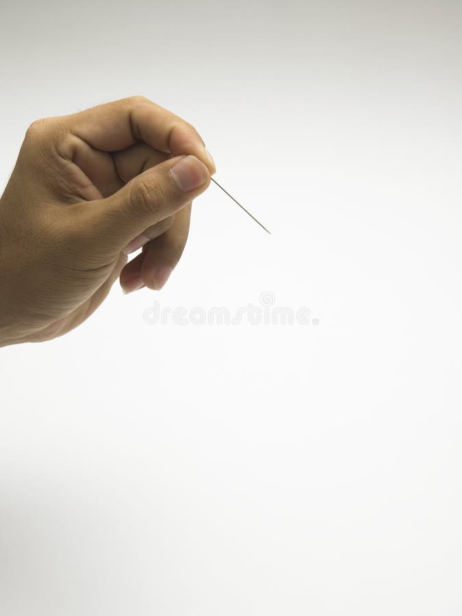 Hand holding a needle stock photo. Image of needle, holding 9860322