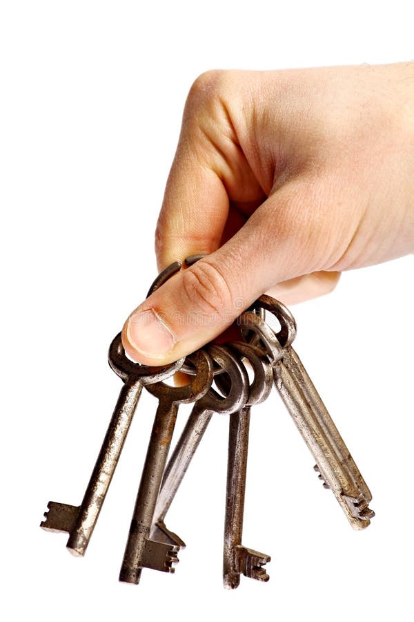 Hand holding old rusty keys stock photography