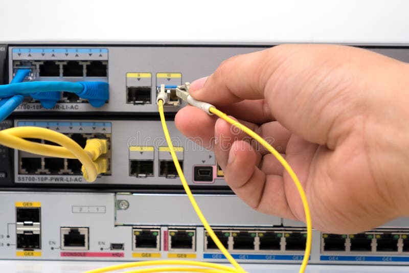 Fiber Optical and Network Cables with Internet Wireless Router on a Blue Backgro