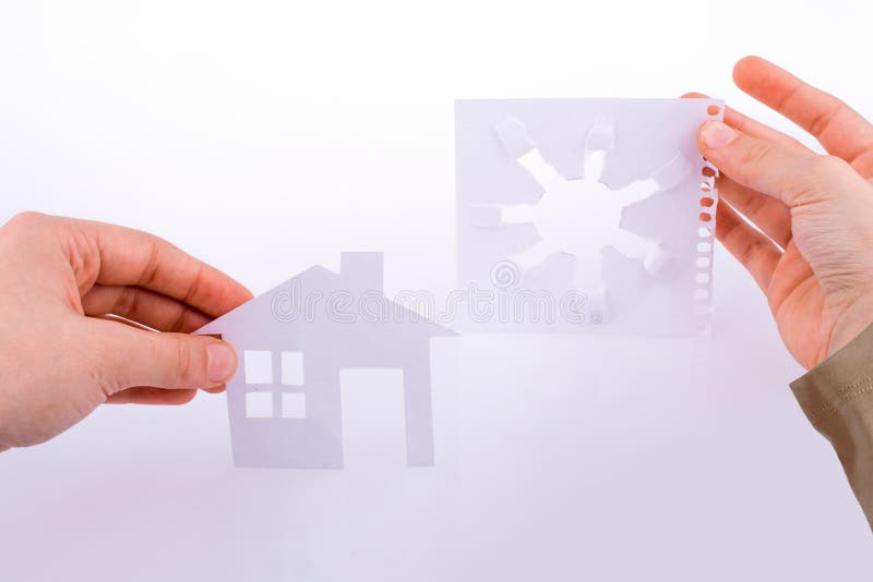 Hand Holding a Paper House and a Paper Art Stock Photo Image of