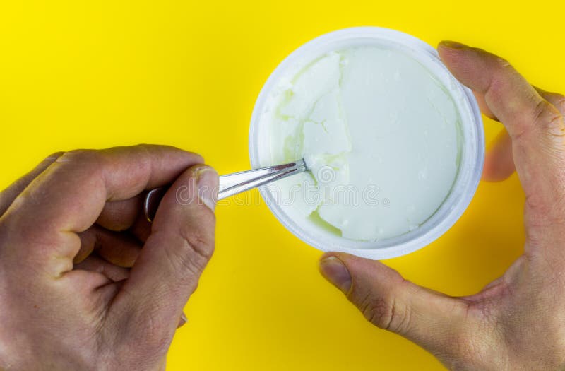 Hand Holding Plastic Cup with Natural Yogurt and Spoon Stock Photo Image of healthy, closeup