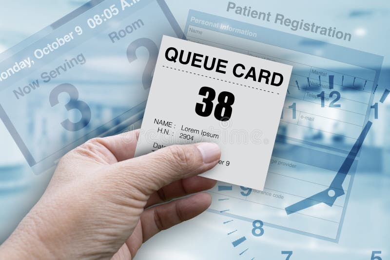 Hand holding queue card for patient who waiting in line for medical treatment stock image