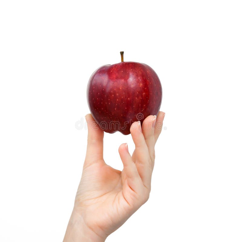 Hand holding a red apple