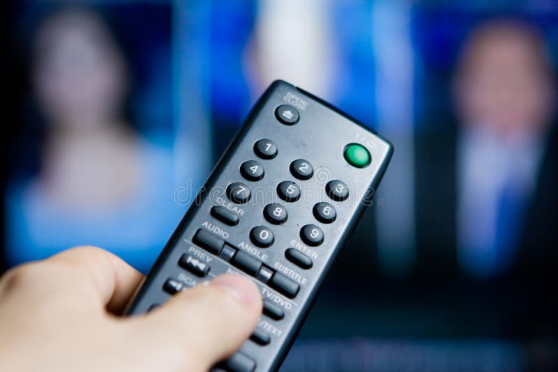 Hand holding a remote control stock photography