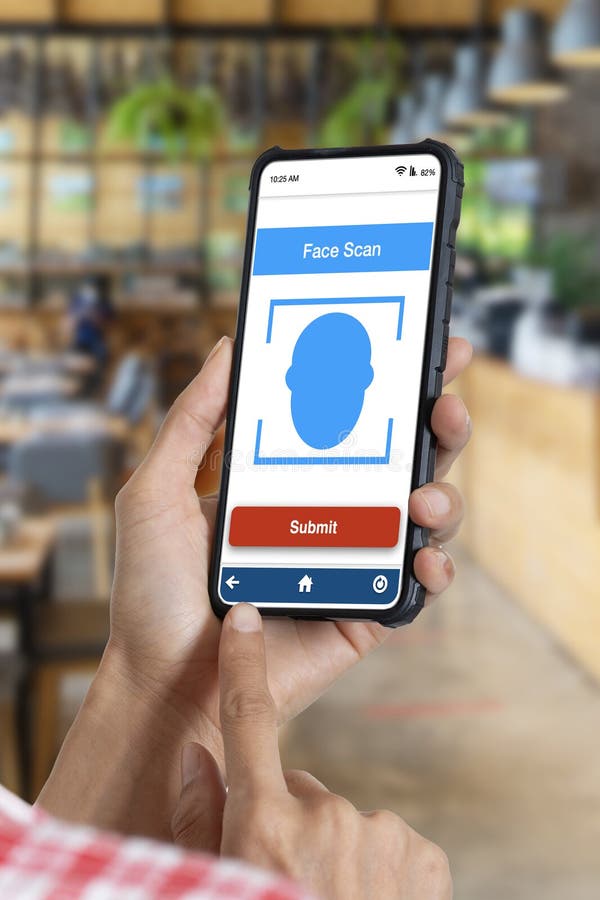 Hand holding smartphone showing face scan application on screen royalty free stock image