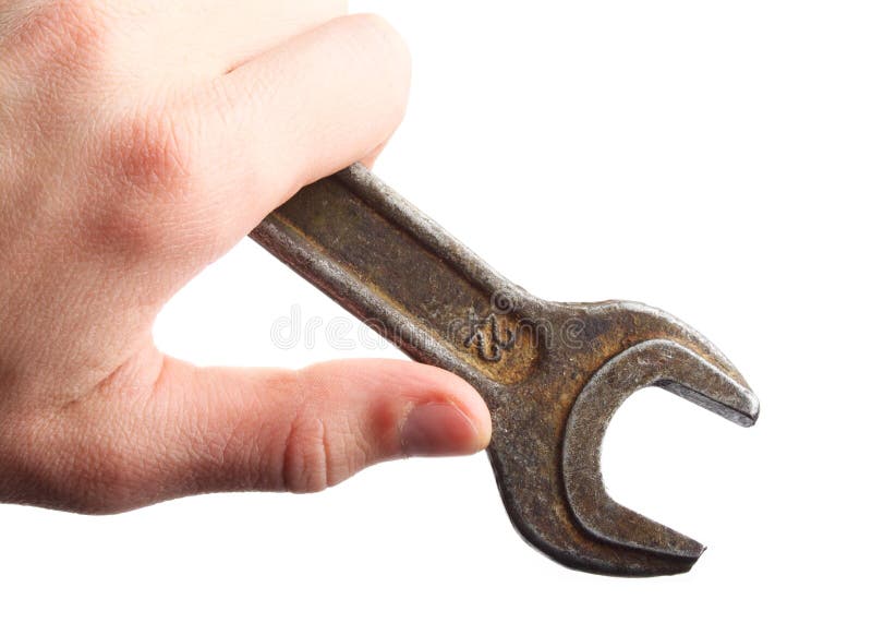 Hand holding spanner; wrench. repair