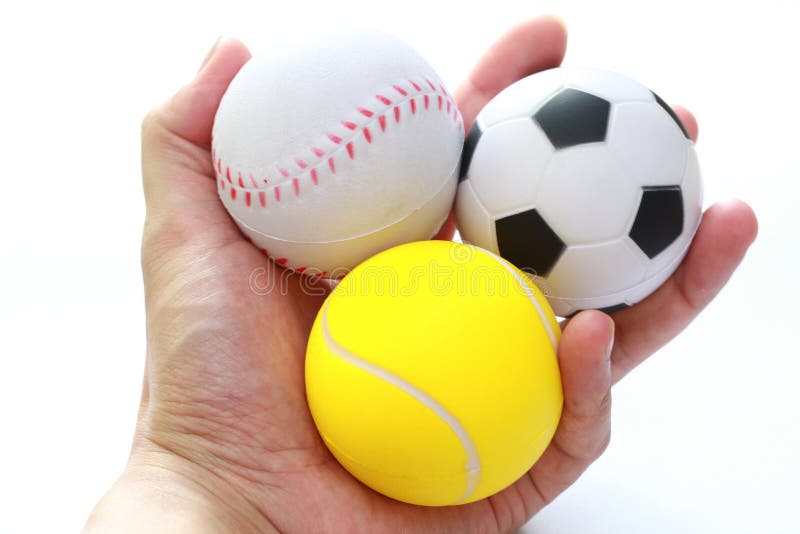 Hand holding sport balls stock image. Image of fingers 17392291