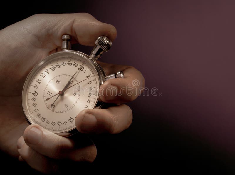 Hình ảnh về Hand Holding Stopwatch Against a Black Background sẽ cho bạn kinh nghiệm cảm giác như thật với việc nắm trên tay một chiếc đồng hồ bấm giờ và đo thời gian của mình. Hãy truy cập để có trải nghiệm thú vị.
