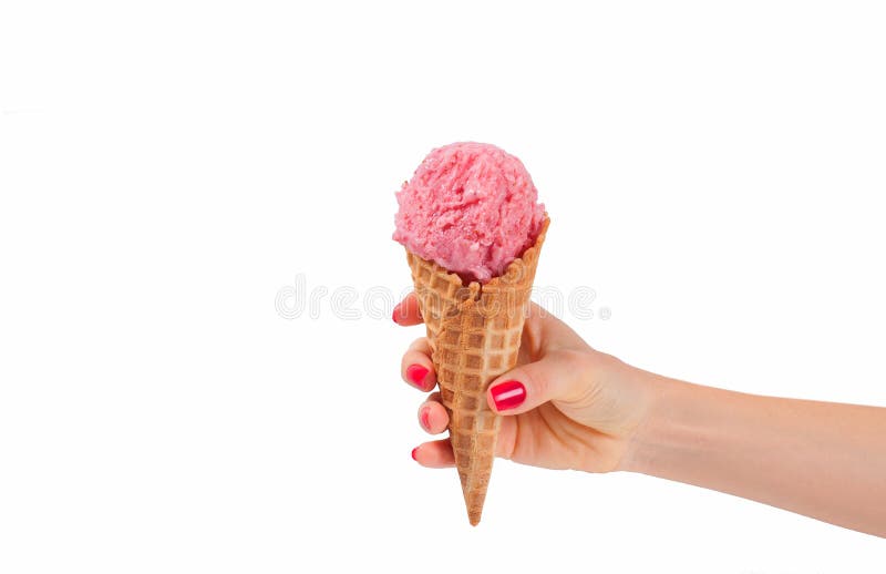 Hand holding strawberry ice cream cone on white background stock photography