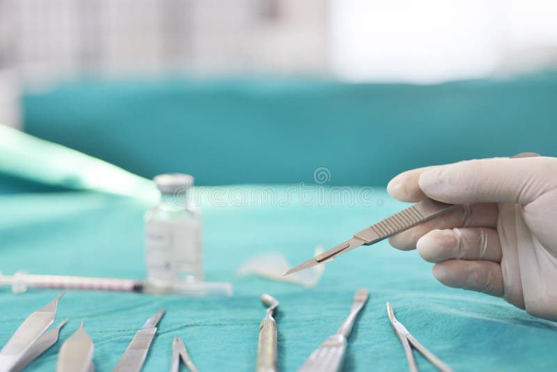 Hand Holding Surgical Instruments Stock Photo Image of color