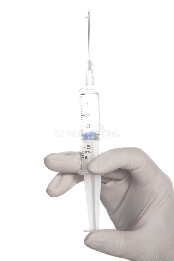 Hand holding syringe