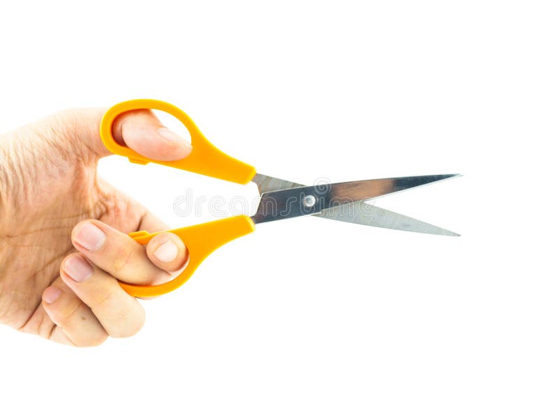 Hand holding used orange scissor royalty free stock photos