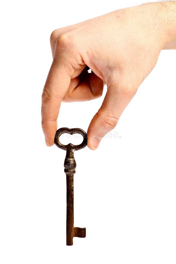 Hand holding vintage door key stock image