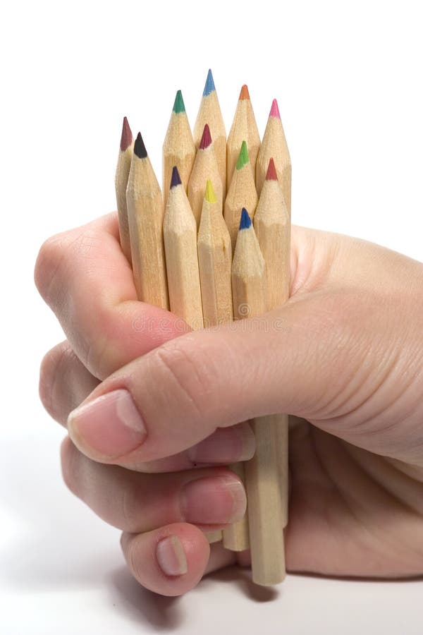 Hand holding wooden pencils