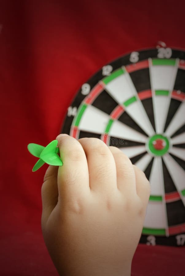 A Man Holds a Dart for Playing Darts, Takes Aim, Ready To Throw Darts