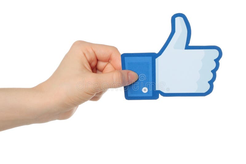 Hand holds facebook thumbs up sign