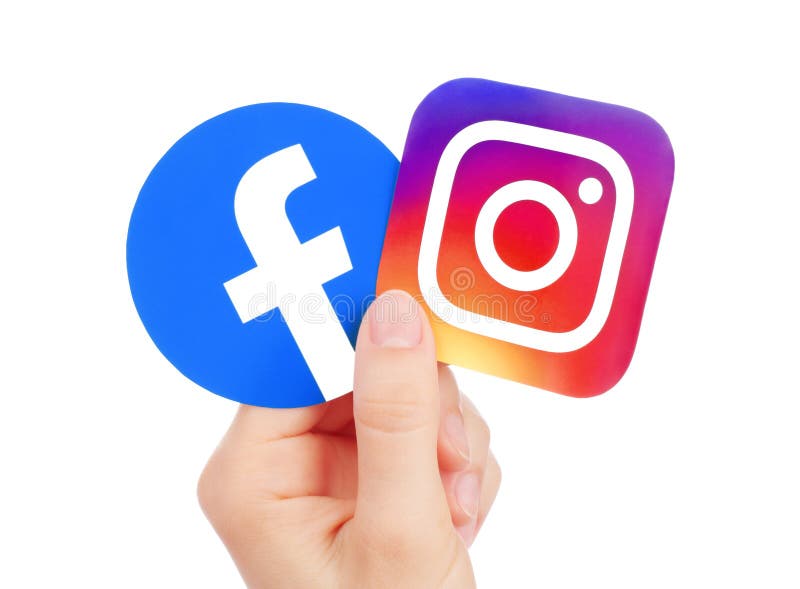 Kiev, Ukraine - May 15, 2019: Hand holds new Facebook logo and Instagram printed on paper. Instagram is a photo and video-sharing social networking service owned by Facebook