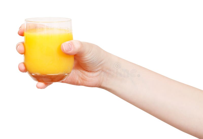 Hand hält Glas mit frischem Orangensaft lizenzfreies stockbild Hand hält Glas mit frischem Orangensaft lizenzfreies stockbild