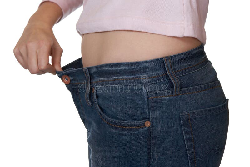 Hand and jeans - weight loss royalty free stock photography